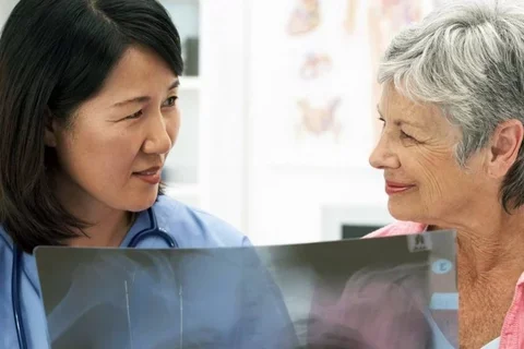 a patient consults with her physician