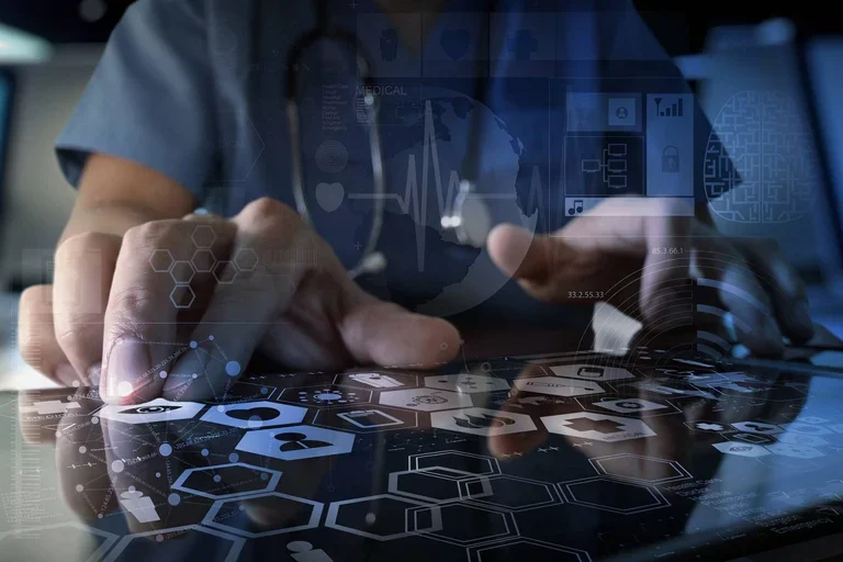 Doctor typing on touchscreen